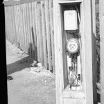 Dagenham street lighting, showing timer working in pillar, next to fence in Crescent Road, 1965