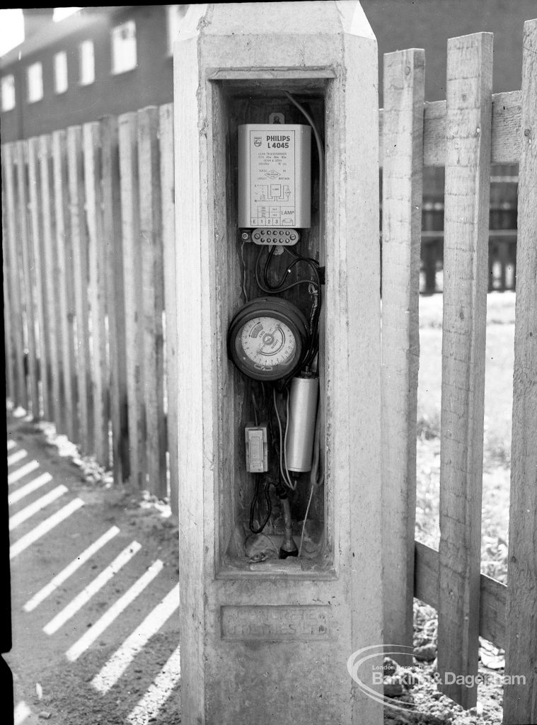 Dagenham street lighting, showing timer workings in pillar, next to fence in Crescent Road [north side of south limb, at Frizlands Lane corner], 1965
