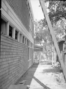 Barking Central Library reconstruction, showing exterior view along north side with alley, 1965