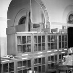 Barking Central Library reconstruction, showing cabinets beneath cleared archway, 1965