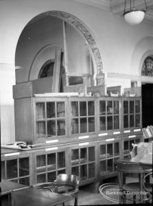 Barking Central Library reconstruction, showing cabinets beneath cleared archway, 1965
