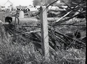 Riverside Sewage Works Reconstruction V, showing rubbish flung against railway fence, 1965