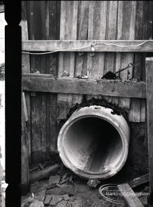 Lower Wantz Sewer Environment scheme II, showing the end of concrete pipe, projecting from beneath railway, 1965