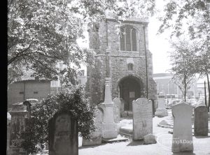 Old Barking, taken for ‘Barking Record’, showing oblique view of rear of Curfew Tower, and with trees and tombstones, 1965