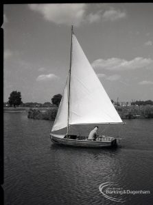 Boating at Mayesbrook Park, Dagenham, showing side view of sailing yacht, 1965