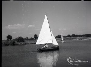Boating at Mayesbrook Park, Dagenham, showing side view of sailing yacht, 1965