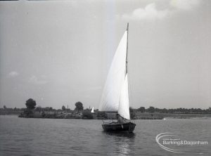 Boating at Mayesbrook Park, Dagenham, showing view of sailing yacht against island, 1965