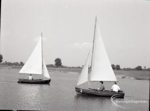 Boating at Mayesbrook Park, Dagenham, showing two sailing yachts approaching each other, 1965
