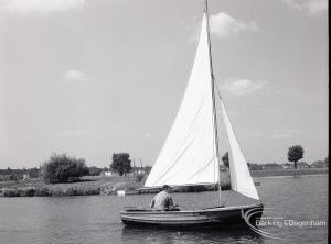 Boating at Mayesbrook Park, Dagenham, showing yacht sailing from left to right, 1965