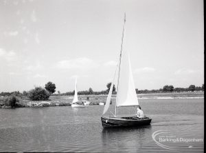 Boating at Mayesbrook Park, Dagenham, showing sailing yacht approaching, 1965