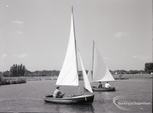 Boating at Mayesbrook Park, Dagenham, showing oblique view of two sailing yachts passing each other, 1965