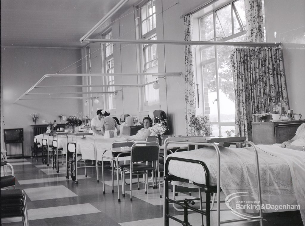 Health education, showing south side of Dagenham Hospital lower ward, with two nurses and patients, 1965