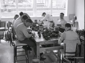 Schools for disabled children, showing young people doing paid electrical work at Osborne Square Training Centre, 1965