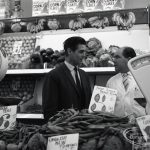 Health education, showing Inspector talking to member of staff in greengrocery section at Wallis Supermarket, Rush Green, 1965