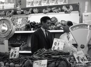 Health education, showing Inspector talking to member of staff in greengrocery section at Wallis Supermarket, Rush Green, 1965