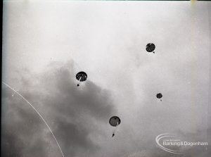 Dagenham Town Show 1965, showing a free fall parachute display by members of the Green Jackets Brigade, with four parachutists nearing the ground, 1965