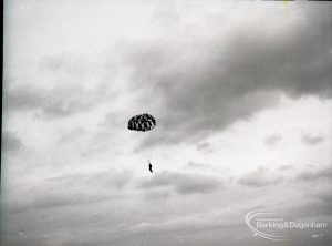 Dagenham Town Show 1965, showing a free fall parachute display by members of the Green Jackets Brigade, with parachutist in the clouds, 1965
