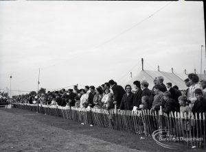 Dagenham Town Show 1965, showing members of the watching audience standing behind fences, 1965