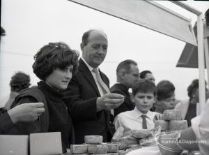 Dagenham Town Show 1965, showing group of people waiting for food, 1965