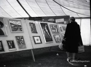 Dagenham Town Show 1965, showing pictures in art exhibition and woman visitor, 1965
