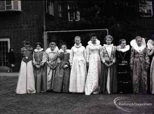 Dagenham school play, with children performing Columbus Sails, showing the girls as ladies of Queen Elizabeth’s court, with queen, 1965