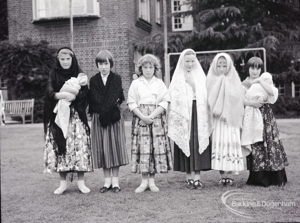 Dagenham school play, with children performing Columbus Sails, showing the sailors’ wives, some with babies in arms, 1965