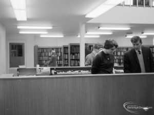 New Barking Library Lending Department, showing two members of staff at counter, 1965