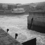 Barking Creek, showing the flow of water with vessel moored at warehouse beyond [continues EES10769 from the west], 1966