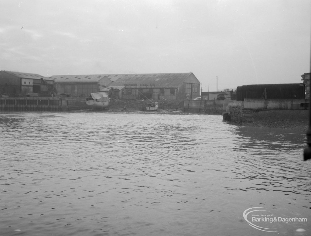 Barking Creek, showing warehouses and covered boat from centre of quay, 1966