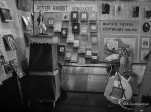 Barking Libraries exhibition at Valence House, Dagenham for National Book Week, showing Beatrix Potter Centenary stand with books, cut-out of mouse, and model of Peter Rabbit, 1966