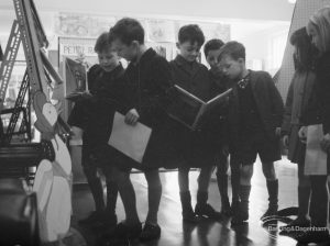 Libraries exhibition at Valence House, Dagenham for National Book Week, showing five boys looking at books, 1966
