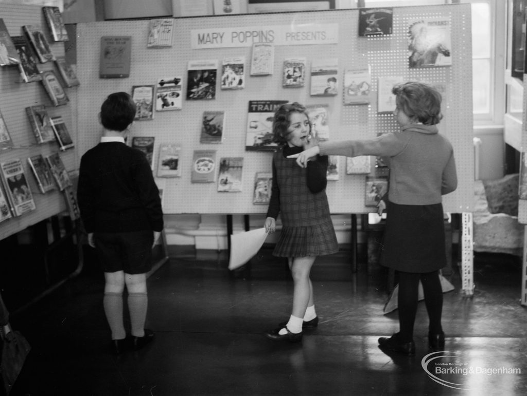 Barking Libraries exhibition at Valence House, Dagenham for National Book Week, showing children looking at the ‘Mary Poppins Presents’ display stand, 1966