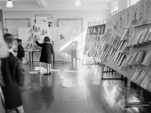 Barking Libraries exhibition at Valence House, Dagenham for National Book Week, showing children looking at the display stands at east and south-east sides, 1966
