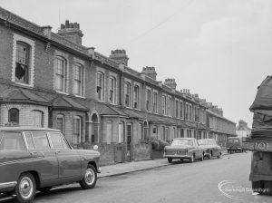 Housing in Gascoigne area, Barking, showing old houses to be demolished, and parked cars, 1966
