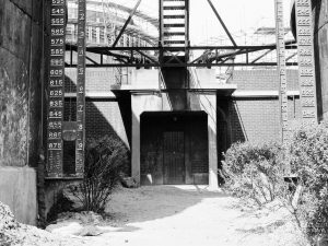 Riverside Sewage Works Reconstruction XI, showing former buildings to be demolished, with tank at left, 1966