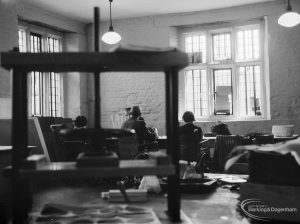 Training Centre at Eastbury House, Barking, showing group of people in Tudor Room, seen through press in foreground, 1966