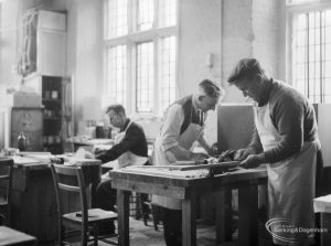 Training Centre at Eastbury House, Barking, showing men doing woodwork, with two at a workbench and another to their left, 1966