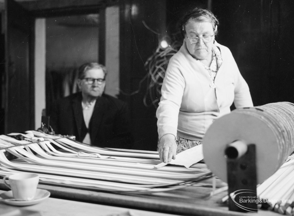 Training Centre at Eastbury House, Barking, showing view from inside Solarium showing woman standing at roller and trailing strips, 1966