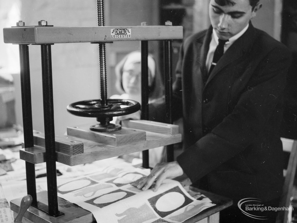 Training Centre at Eastbury House, Barking, showing man at press, with woman behind, 1966