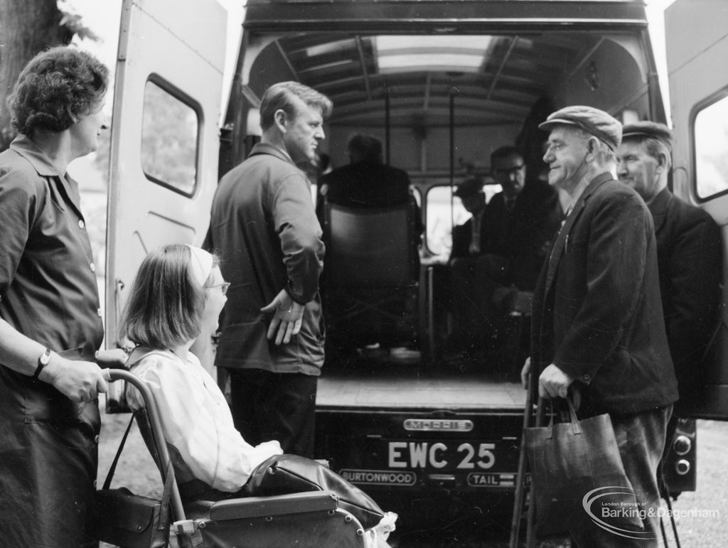 Training Centre at Eastbury House, Barking, showing three men and wheelchair user outside ambulance, leaving after event, 1966