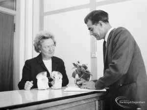 Public Health, showing Domestic Help Organiser Mrs Everett at desk with client, 1966