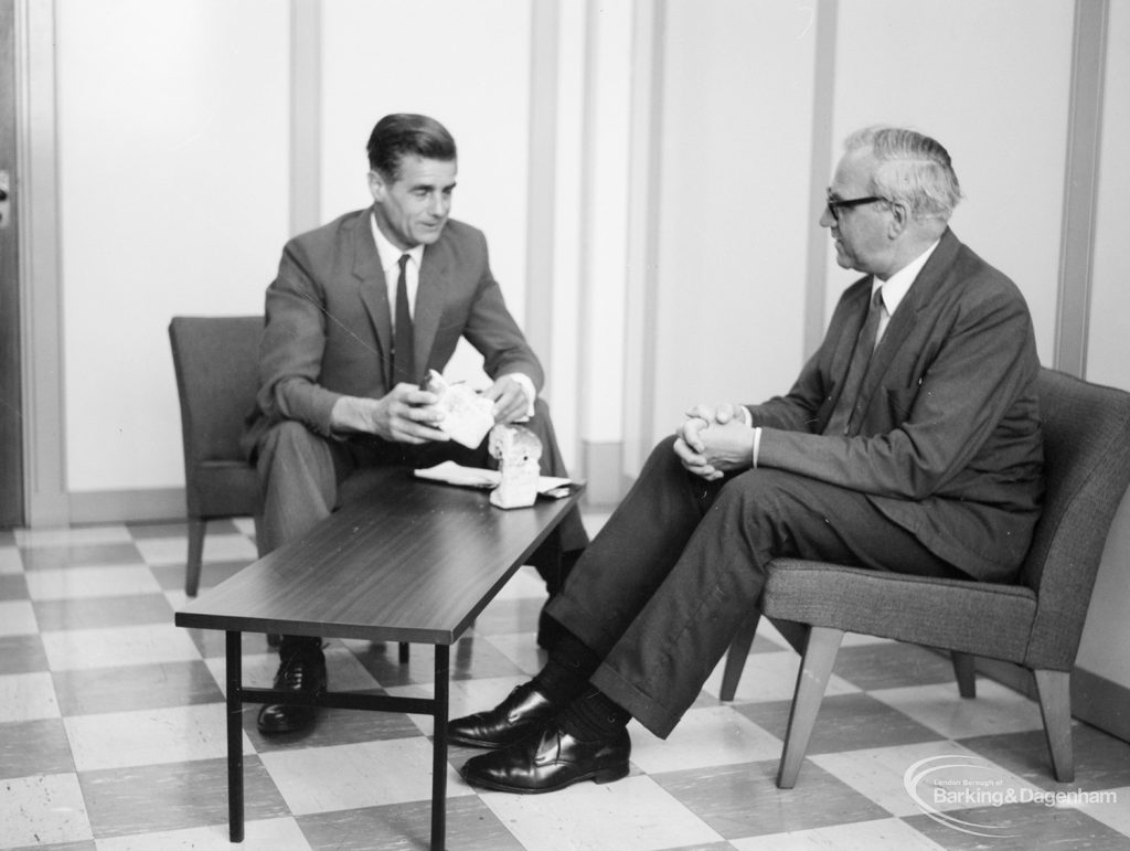 Public Health, showing Health Inspector sitting in interior room with manufacturer, 1966