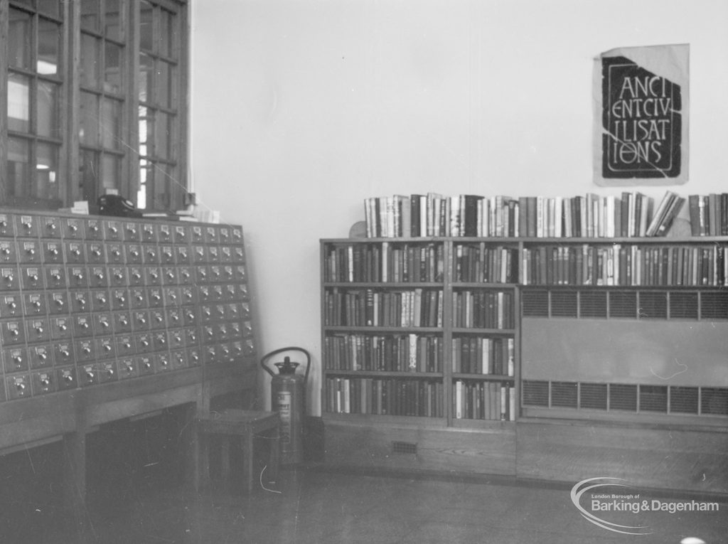 Rectory Library, Dagenham, showing lending catalogue, bookshelves, heater and poster, 1966