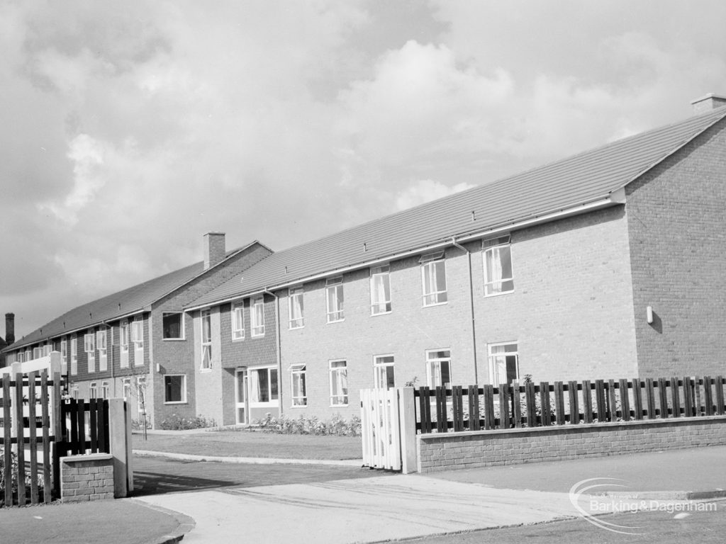 Exterior of terraced houses and decorative fence [possibly in Dagenham], 1966