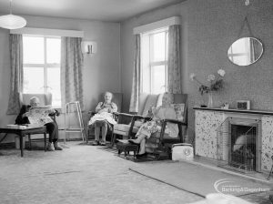 Mayesbrook, Bevan Avenue, Barking, showing the members lounge and service users sitting by the fireplace, 1966