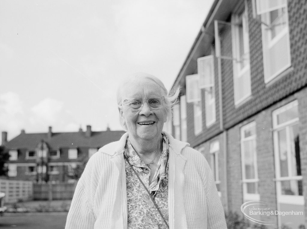 Mayesbrook, Bevan Avenue, Barking, showing an unnamed lady resident outside on the lawns, 1966