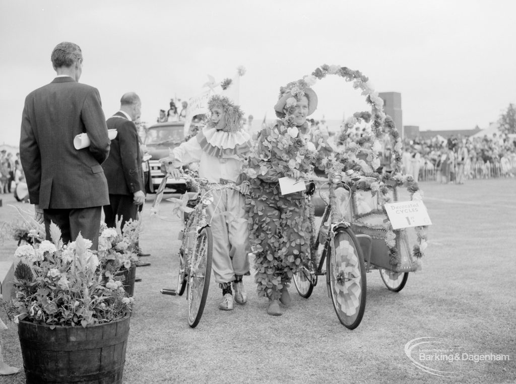 Dagenham Town Show 1966, showing people in fancy dress with decorated bicycles, 1966