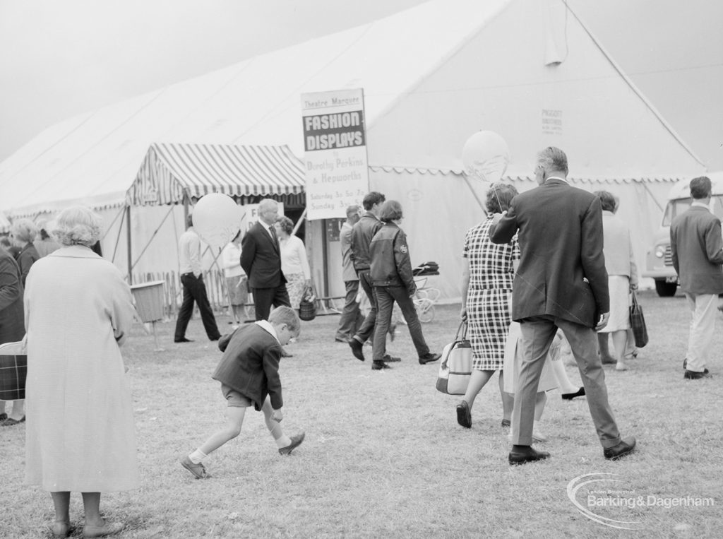 Dagenham Town Show 1966, showing visitors walking past the fashion display tent, 1966