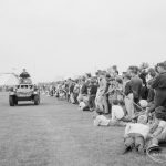 Dagenham Town Show 1966, showing spectators watching tanks from the second Royal Tank Regiment leaving the Arena, 1966