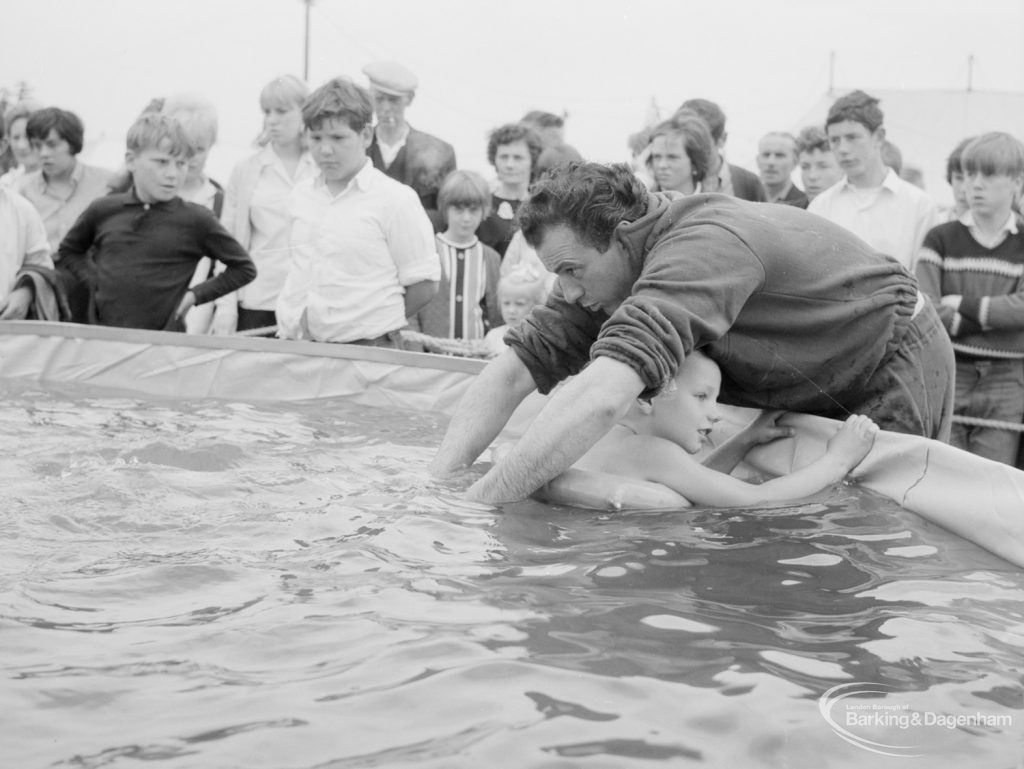 Dagenham Town Show 1966, showing a swimming instructor helping a children in the Dagenham Swimming Club pool, 1966